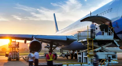 Large plane with cargo being removed