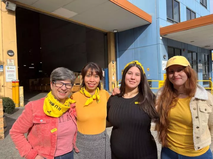Fracht employees wearing yellow “R U Ok?” bandanas