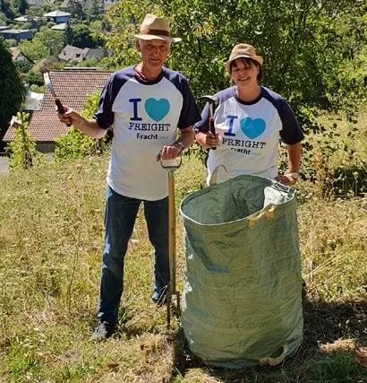 Fracht employees cleaning up a vineyard