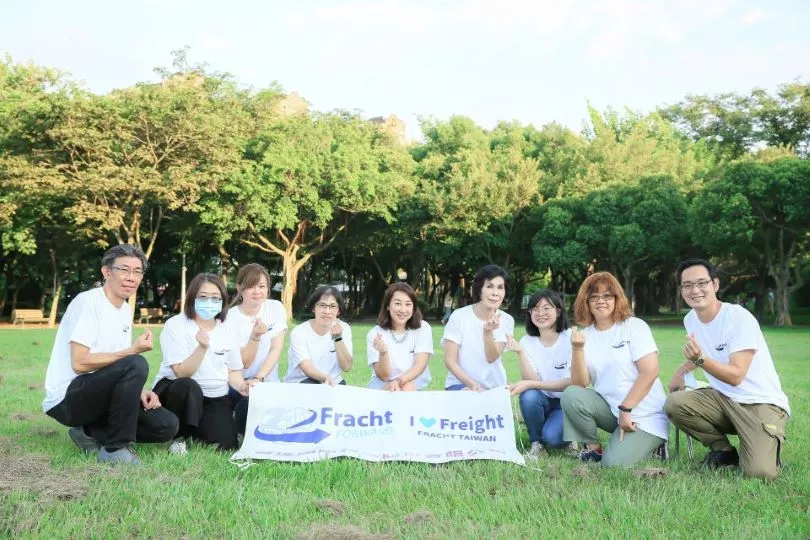 Fracht employees in a park