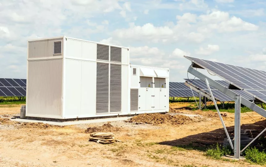 Transformer and inverter on solar panels background