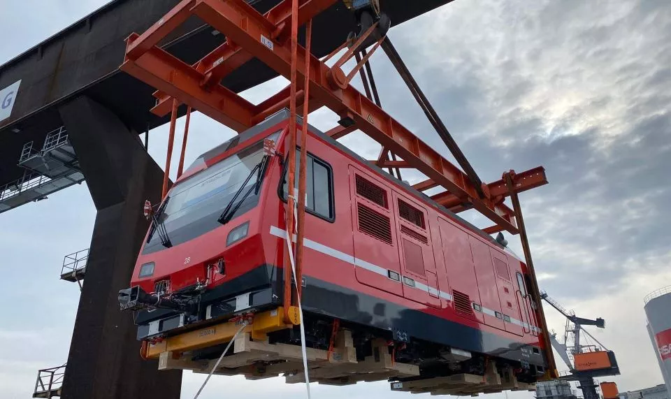 Vehicle being lifted by a crane