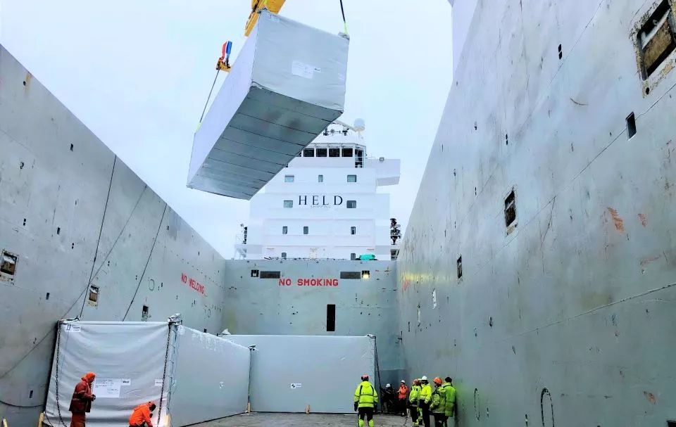 Shipping container being transported