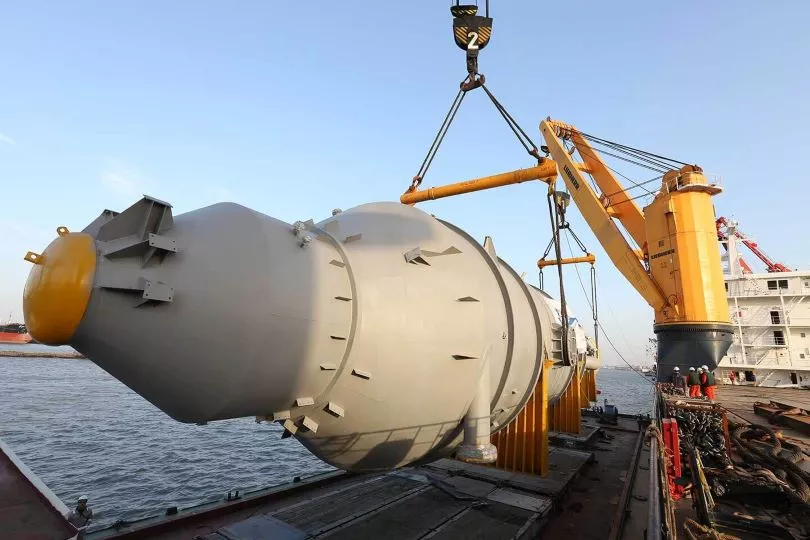 Large piece of cargo being lifted by a crane