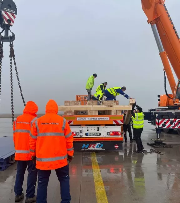 Workers securing freight