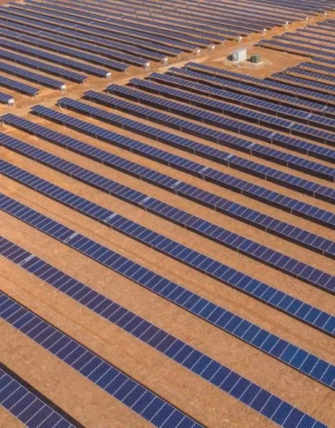 Rows of solar panels in field