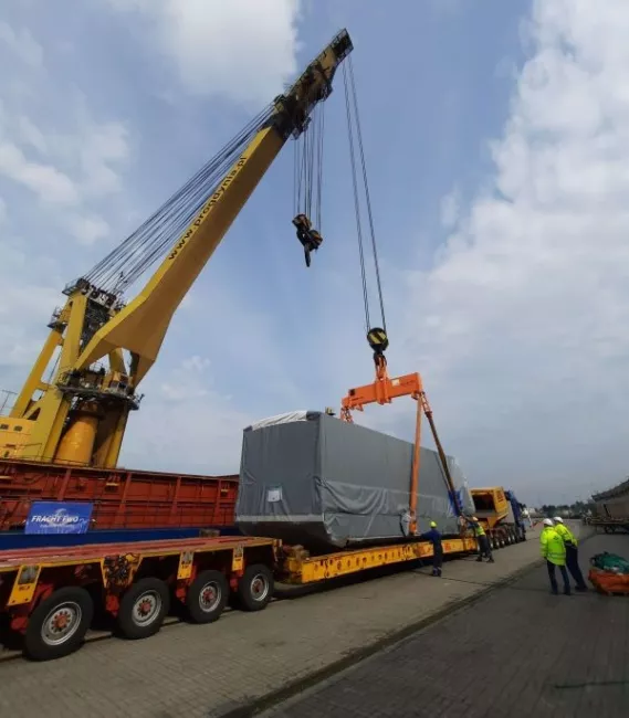 Large piece of freight being transported by truck