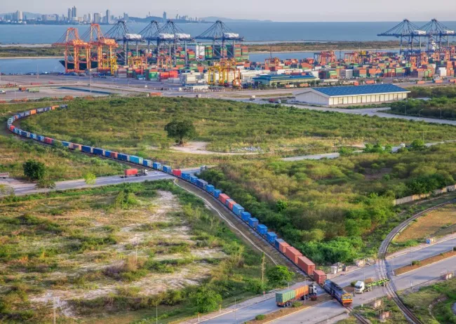 Overhead view of freight train and shipping channel