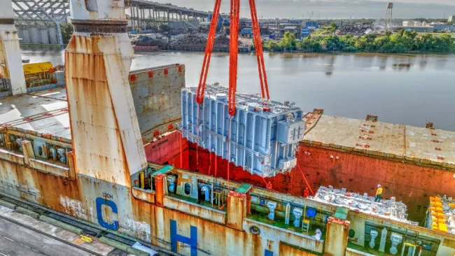 Shipping container being lifted